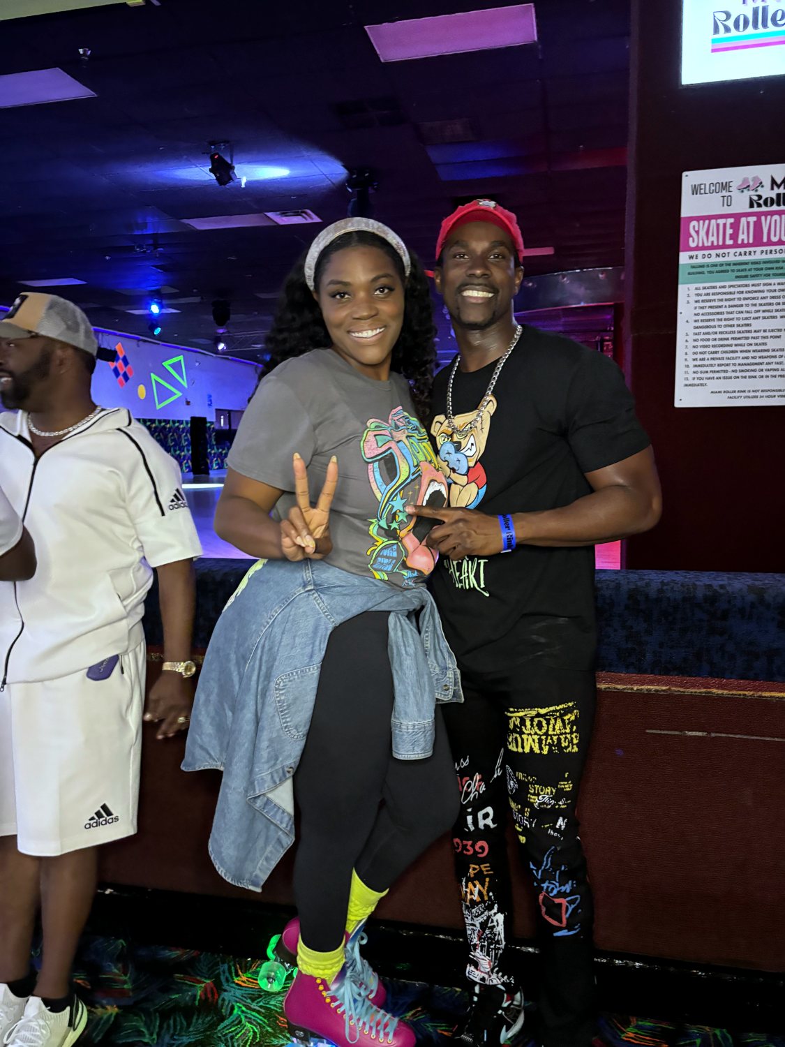 A group of adults gathered together at Miami Roller Rink for a private group event