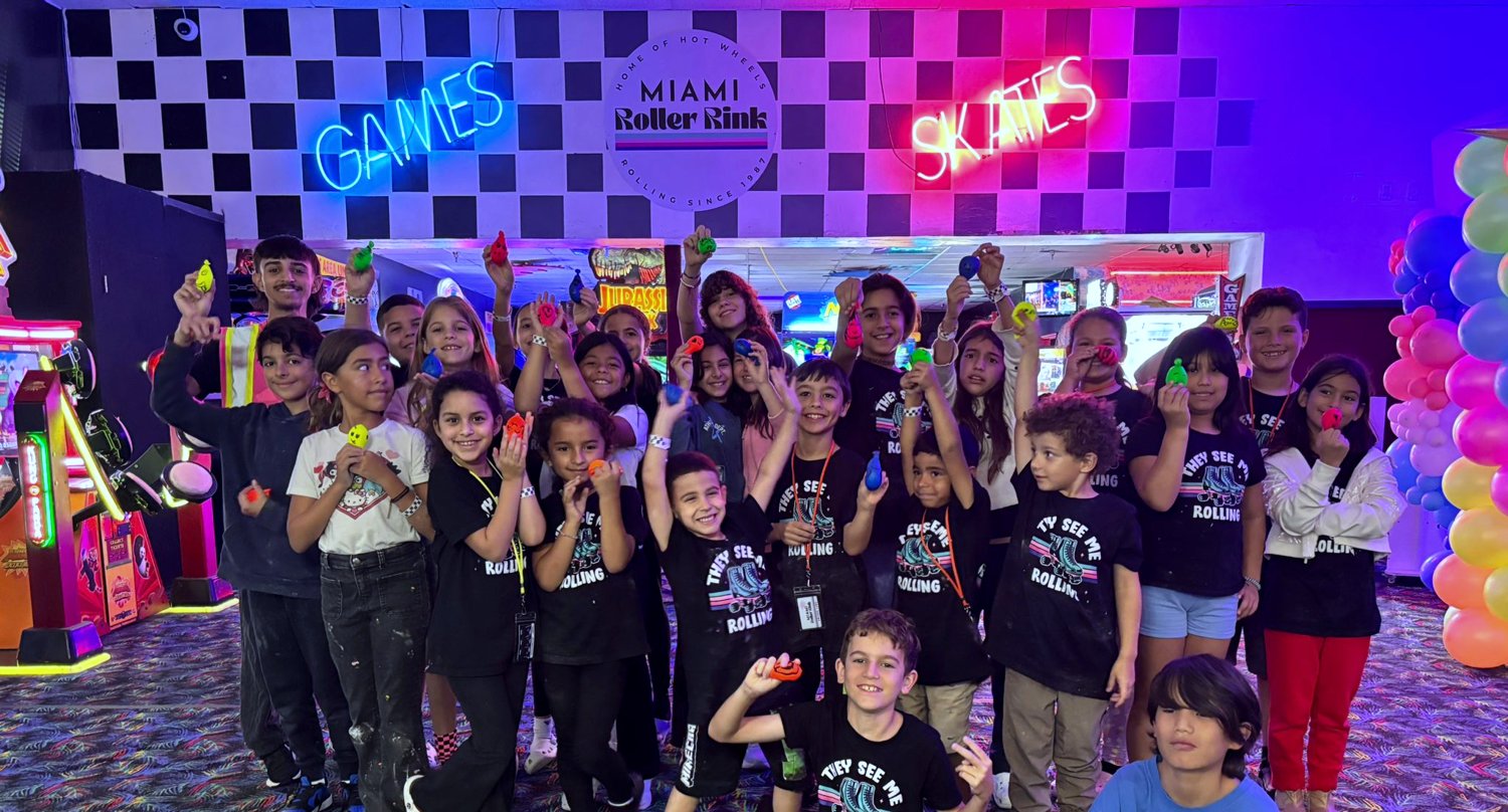 A group of kids on skates at Miami Roller Rink