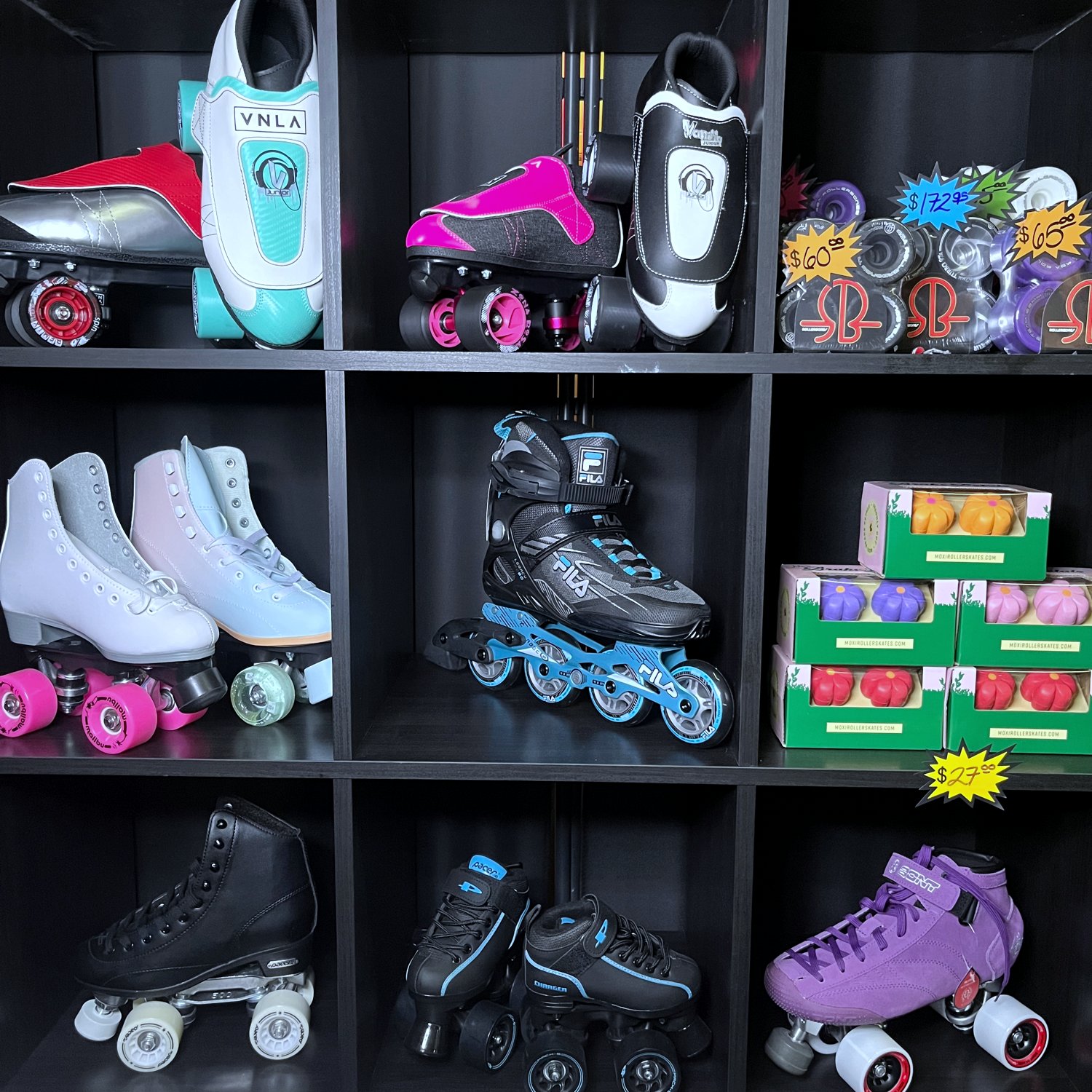 Roller skates and gear on the skate shop wall